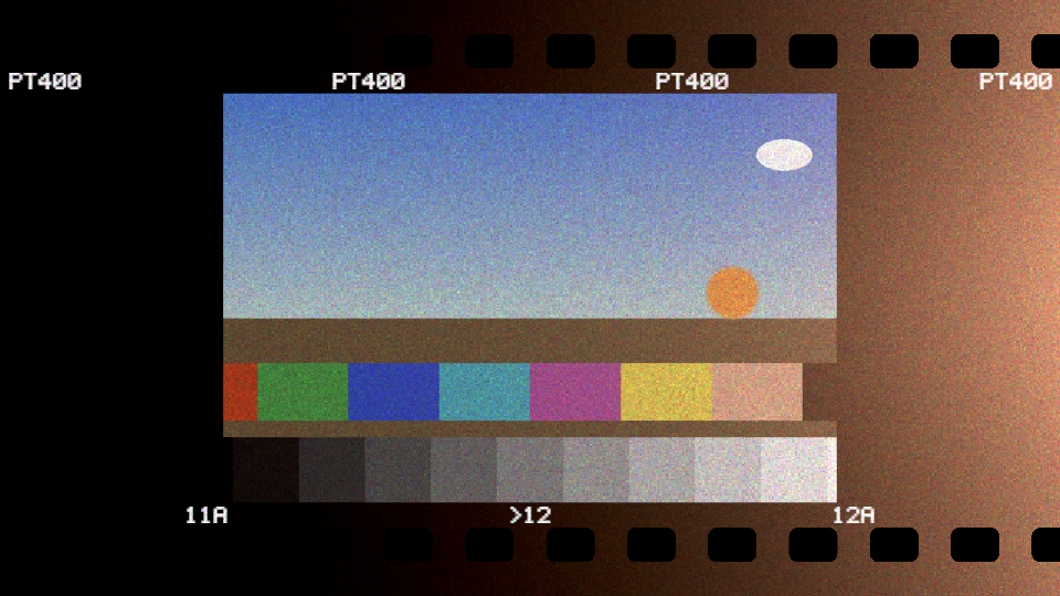 A test card on a strip of 35 mm colour negative, scanned and inverted: fine grain, a warm light leak burning in from the right edge across the rebate, sprocket holes, and edge print reading PT400, 11A, >12 and 12A