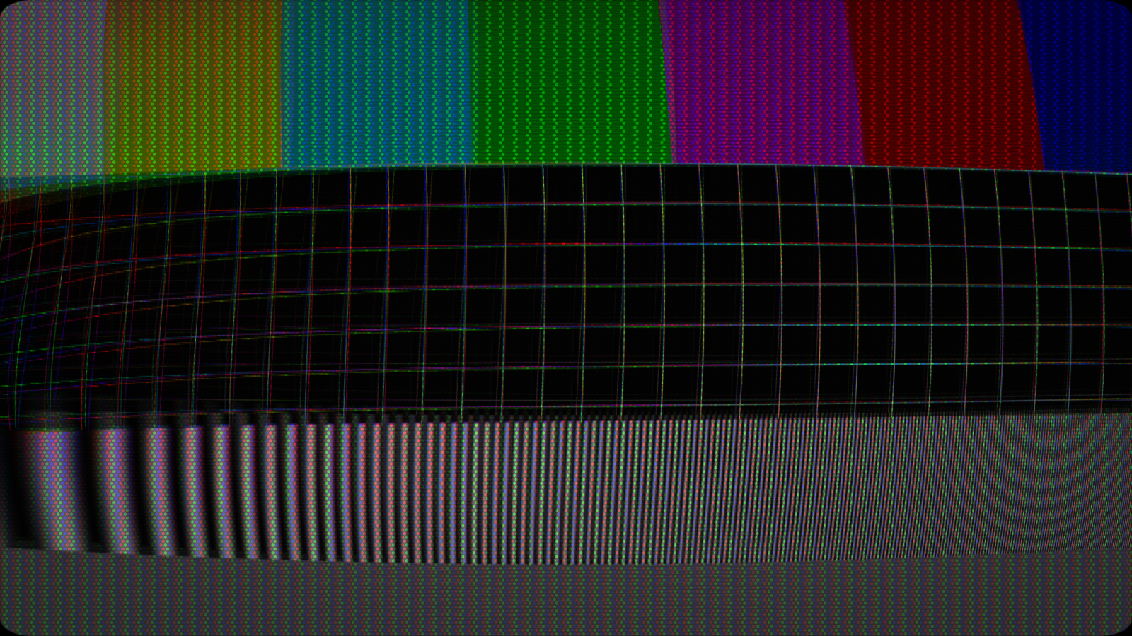 A CRT mid-degauss: the picture swollen and dimmed, the raster skewed, colours rotated off their phosphors