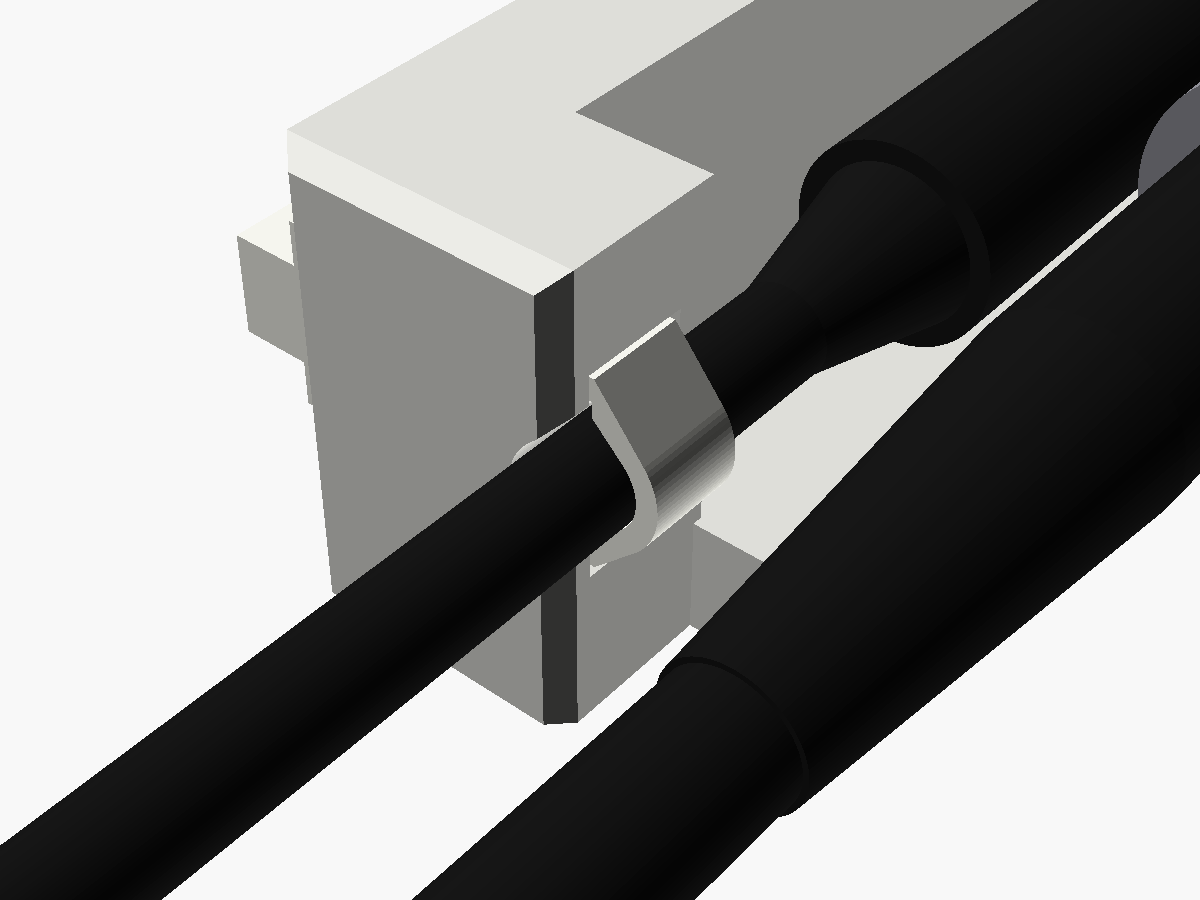 Close render of the 12 V cable tied into the groove in the clamp's block, beside a BNC plug
